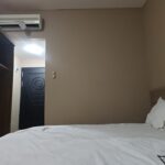 Simple rooms with flat-screens in a humble budget hotel featuring a restaurant & a lobby lounge.
