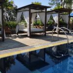 an outdoor pool & tennis courts.