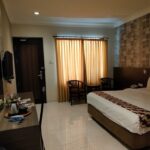 an outdoor pool & a cafe.