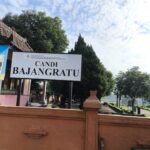 Centuries-old red-brick temple & gateway with carved reliefs