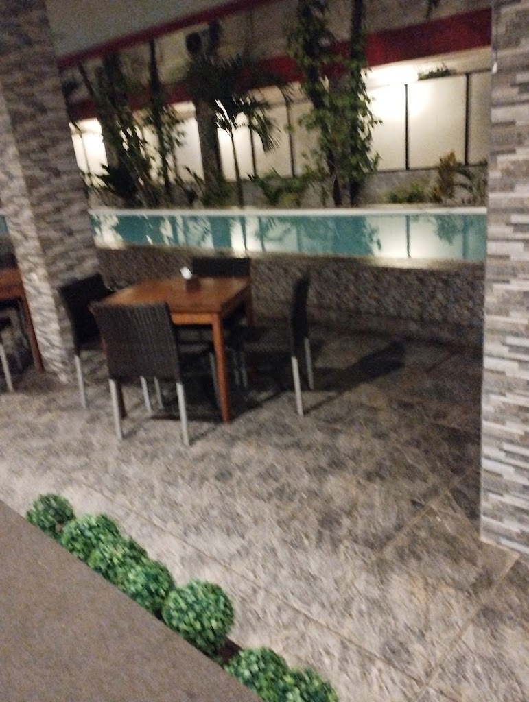 Unpretentious rooms in a down-to-earth hotel featuring an outdoor pool & a cafe.