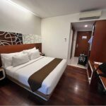 Straightforward rooms in an unassuming hotel featuring complimentary Wi-Fi & a 24/7 snack store.