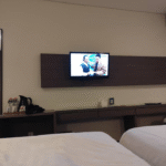Cozy rooms in a plain homestay offering an open-air TV lounge & a cafe