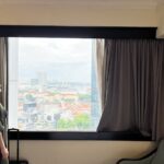 Polished rooms in an upscale hotel with an airy restaurant