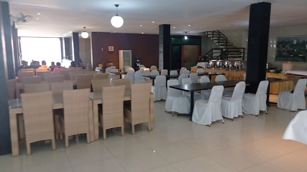 an outdoor pool & a fishing pond.