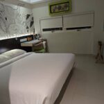 Bright rooms in a budget property offering an outdoor pool