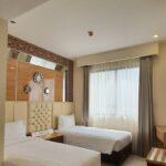 Down-to-earth rooms in a casual hotel with a cafe
