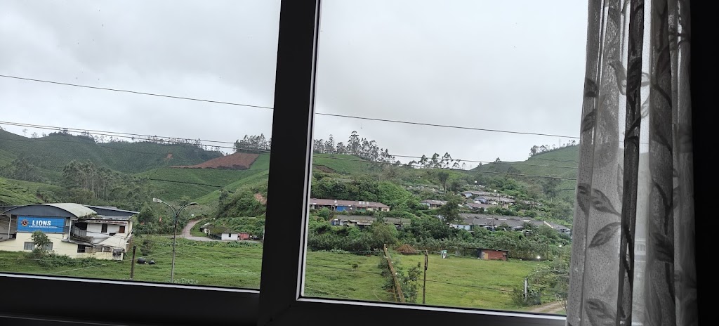 Modest hotel offering simple rooms with river or tea plantation views