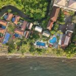 Polished rooms & villas in a bright beachfront hotel offering an outdoor pool