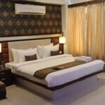 Casual rooms in an unassuming hotel featuring an outdoor pool & a restaurant