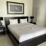 Airy villas in a polished beachfront boutique hotel with dining