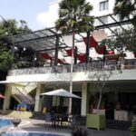 an outdoor pool & a restaurant.