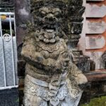Large Hindu temple on a cliff above the Indian Ocean with Balinese gardens & a multi-tiered shrine.