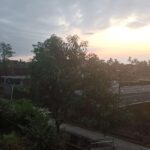 Simple rooms with TVs in a humble budget hotel featuring a prayer room