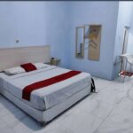 Plain rooms with outdoor seating in a basic hotel offering parking