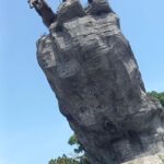 dramatic statue made of copper.