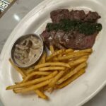 Warmly decorated rooms in a neoclassical-style building with gardens