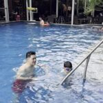 an outdoor pool & a buffet restaurant