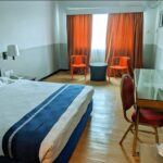 No-nonsense rooms with sitting areas in a casual hotel offering meeting & event space.