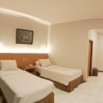 Simple rooms in a low-key hotel featuring a disco