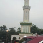 Palm-dotted square beside a mosque