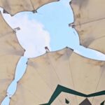 Picturesque park featuring a central fountain surrounded by walking paths