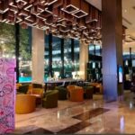 Warmly decorated rooms in an upscale hotel offering a rooftop pool