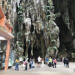 Limestone caves at the top of steep steps housing Hindu temples & shrines