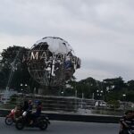 on a busy traffic circle overlooked by parks.