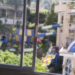 Warm rooms in an upscale ancient Greek-inspired hotel offering 2 pools