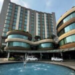 Refined lodging offering warm rooms & 2 restaurants