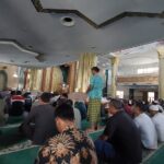 Contemporary mosque around a green central courtyard