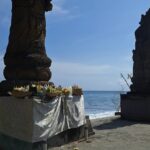 overlooking the sea from a craggy outcrop.