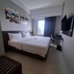 Compact rooms in a streamlined budget hotel featuring parking