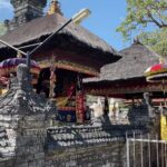 with thatched-roof shrines.