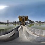 centering on a pool with a giant sculpture of the Koran.