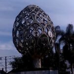 gilded egg within a compact city park.