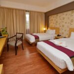 Polished rooms & suites in a refined lodging offering a rooftop pool