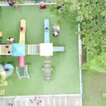 Shade trees dot this popular city park featuring grassy areas & a playground with slides.