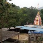 elaborate shrine enveloped in forest