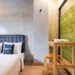 Utilitarian rooms with TVs & a/c in a straightforward budget hotel featuring a lobby lounge.